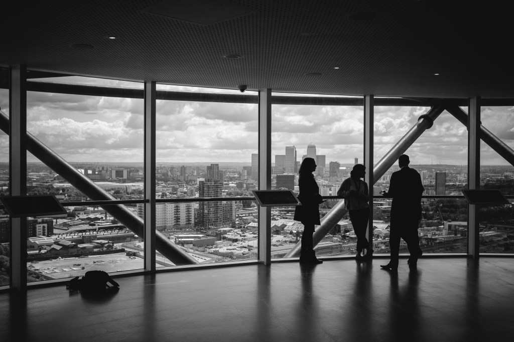 People opening an LLC in front of a window